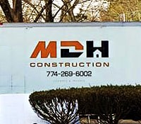 The MDH Construction truck servicing a home improvement project in Plymouth, Massachusetts